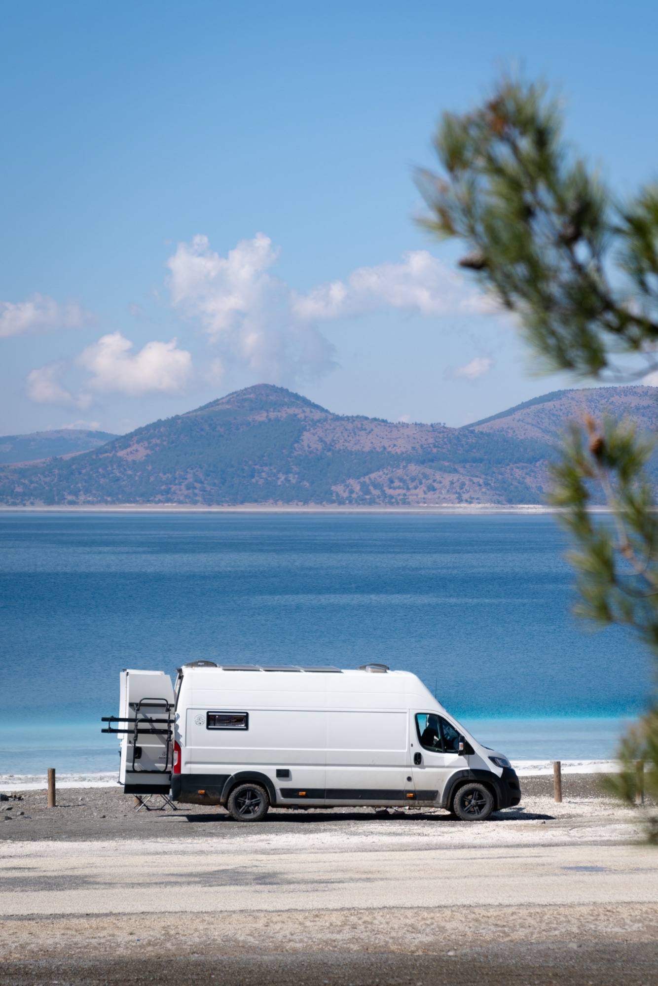 Campervan on black volcanic landscape in Lanzarote